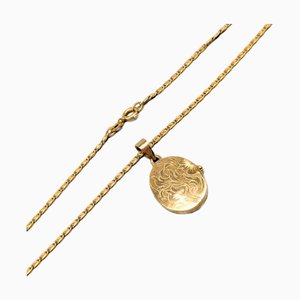 Pulsera Tangle de oro con medallón