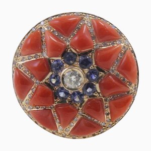 Ring aus Gold mit Diamanten und blauem Saphir