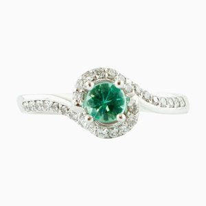 Verlobungsring aus 18 Karat Weißgold mit Diamanten und Smaragd