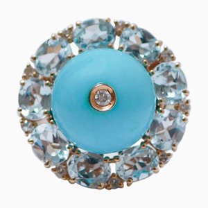 Ring aus Roségold mit Magnesit und Topasen und Diamanten