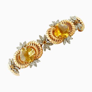 Gliederarmband aus Rosé- und Weißgold mit Diamanten und gelben Topasen