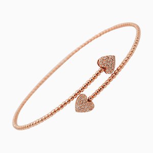 Manschetten-Armband aus 18kt Roségold mit weißen Diamanten und Herzdetails