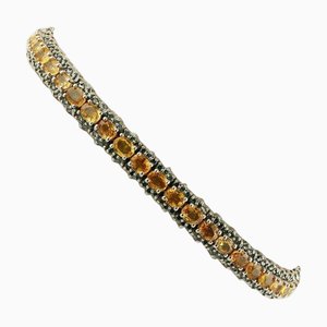 Goldenes Tennisarmband mit Diamant und Saphir