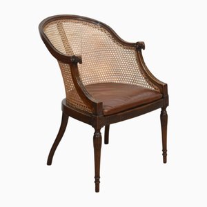 Poltrona Bergere Tub con struttura in mogano, fine XIX secolo