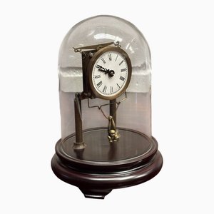 Reloj de esqueleto en estuche con péndulo de mono oscilante