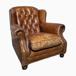 Sillón de orejas Chesterield de cuero coñac