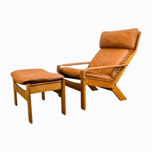 Poltrona e poggiapiedi in faggio e pelle di Westnofa, anni '70