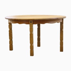 Danish Round Extendable Dining Table in Oak in the style of Henning Kjærnulf, 1960s
