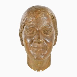 Head of a Woman in Patinated Plaster