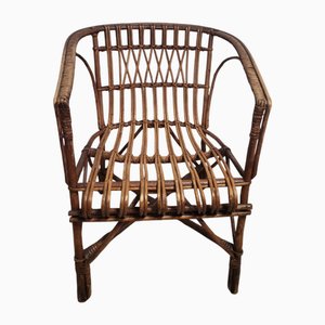 Butaca vintage de bambú con soporte