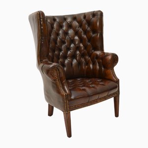 Butaca de orejas antigua con respaldo en forma de barril, 1920