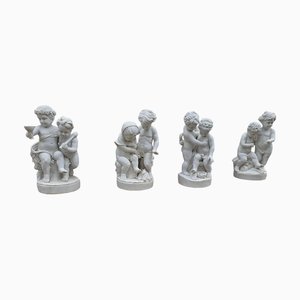 Carrara Marmor Cherub Skulpturen auf Rotem Marmorsockel, Italien, 1980, 4 . Set
