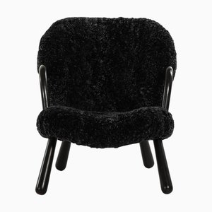 Clam Easy Chair in Black Colored Wood and Sheepskin by Arnold Madsen, 1944