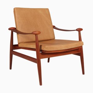 Lounge Chair in Teak and Cognac Leather by Finn Juhl