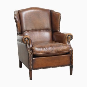 Poltrona a orecchioni in pelle di pecora