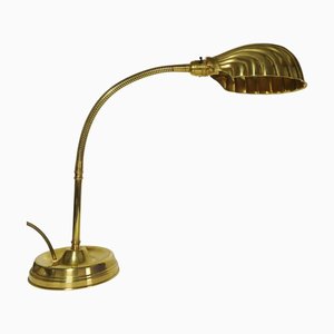 Art Deco Articulated Brass Gooseneck Desk Lamp with Shell-Shaped Brassed Copper Shade and Circular Brass Weighted Base 1920s.