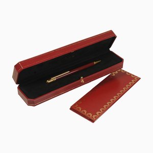 Penna a sfera da 18 carati placcata in oro e laccata rossa con scatola di Cartier, anni '80, set di 2