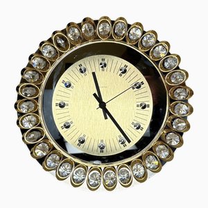 Reloj Hollywood Regency de oro y cristal de Junghans, años 70