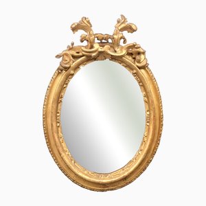 Carved and Gilded Oval Framed Mirror, 1700