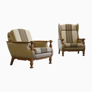 Oak Low and High Back Lounge Chairs in the style of Henning Kjærnulf, Denmark, 1960s, Set of 2