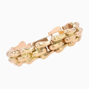 Pulsera articulada de oro rosa de 18 kt, años 60