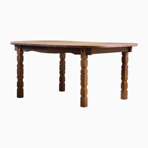 Vintage Danish Brutalist Oval Extendable Oak Dining Table in the style of Henning Kjærnulf, 1960s