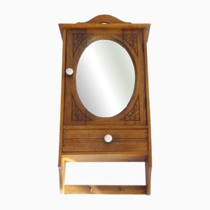 Mobiletto pensile in legno con specchio ovale, anni '40