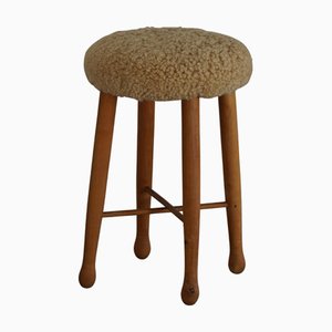 Taburete danés Mid-Century moderno con asiento de lana de cordero, años 60