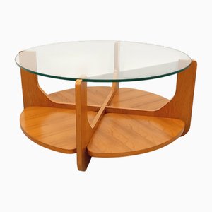 Mesa de centro vintage redonda de teca y vidrio con dos tableros de Hugues Poignant, años 60