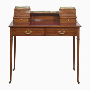 Scrivania in mogano con intarsio in legno satinato, fine XIX secolo