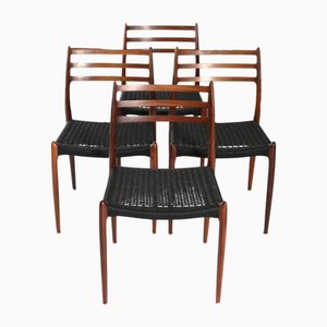 Sillas de comedor modelo 78 de teca con asientos de cordón de papel negro de Niels Otto (NO) Møller para JL Møllers, Dinamarca, años 60. Juego de 4