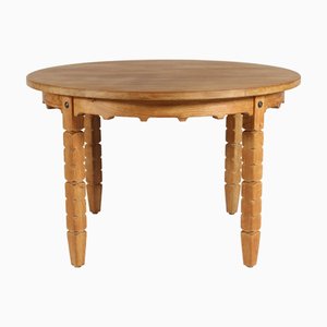 Danish Round Extendable Oak Dining Table in the style of Henning Kjærnulf for Axel Einar Hjorth, 1970s