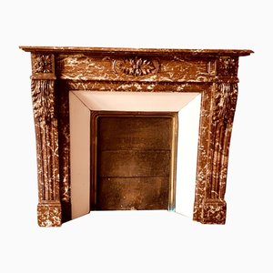 Chimenea de estilo Luis XVI de mármol rojo moteado