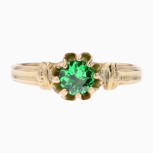Anillo solitario de oro amarillo de 18 kt con granate verde, siglo XX