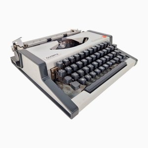 Vintage Traveller De Luxe Typewriter with Case from Olympia, 1970s