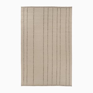 Tejido plano con textura en tonos beige y crema de Rug & Kilim