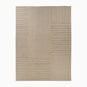 Alfombra con textura en tonos beige y marrón de Rug & Kilim