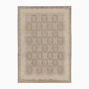 Tappeto beige con motivi geometrici chiari di Rug&Kilim