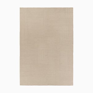 Alfombra con textura en tonos beige y crema de Rug & Kilim