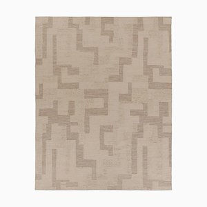 Alfombra con textura en tonos beige y crema de Rug & Kilim