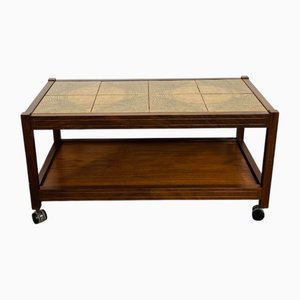 Mesa de centro vintage de teca y cerámica con ruedas, años 60