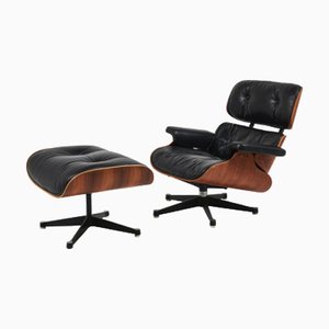 Set aus Modell 670 Sessel und Modell 671 Fußhocker von Charles & Ray Eames für Mobilier International Edition, 1956