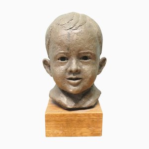 Modell Büste eines sehr jungen lächelnden Jungen, 1940er