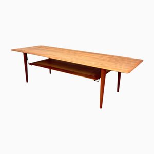 Mid-Century Modern FD-516 Coffee Table in Teak with Raffa and Brass Magazine Storage by Peter Hvidt & Orla Molgaard Nielsen for France & Daverkosen, Denmark, 1960s