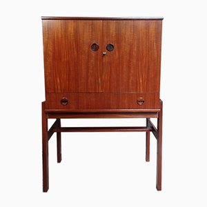 Mobile bar in teak con specchio, mensola in vetro e luce di Turnidge Furniture, anni '60