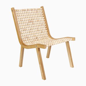 Sillón o432 con esferas de arce de Jean-Frédéric Fesseler