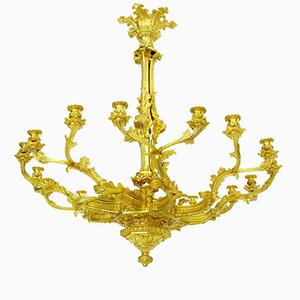 Lámpara de araña francesa antigua dorada con ocho brazos dorados
