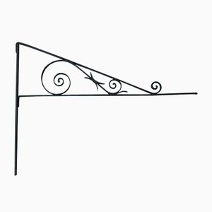 Supporto per insegna di negozio antico in ferro battuto