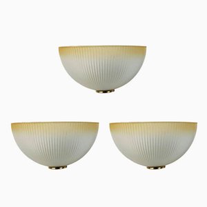 Lámparas de pared italianas de cristal de Murano y latón, años 60. Juego de 3