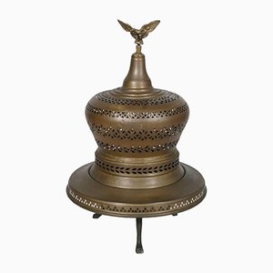 Braciere antico in rame, ottone e ghisa a forma di campana